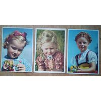 Три открытки. Девочки с цветами. Германия. 1950-е Чистые. Цена за 1.