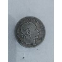 Старая монетка серебро наверное.